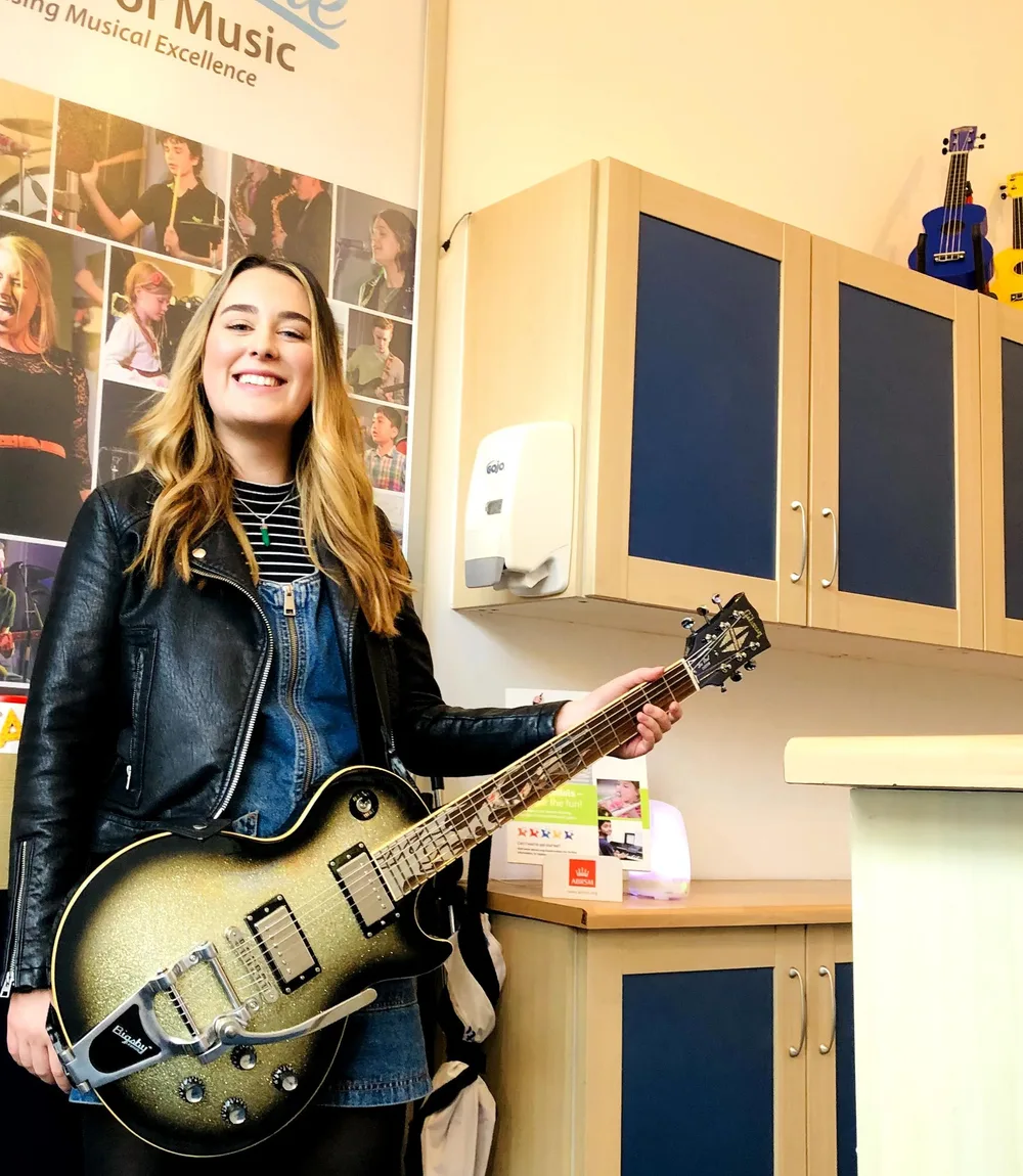 A guitar student with an electric guitar at Rīgas Privātā Mūzikas Skola in Riga